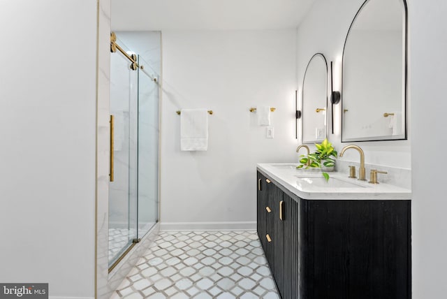 bathroom with a shower with door, tile patterned flooring, and dual bowl vanity