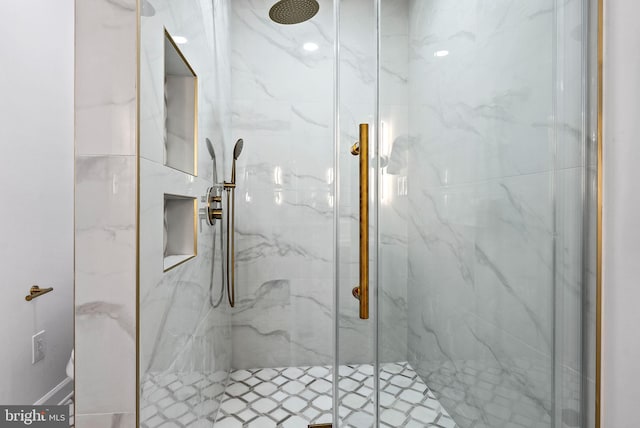 bathroom featuring an enclosed shower