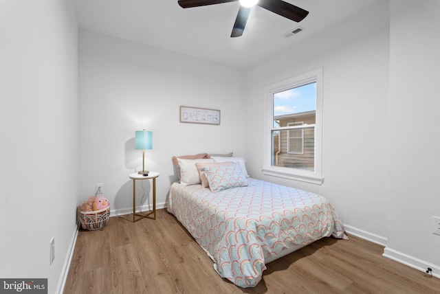 bedroom featuring light hardwood / wood-style flooring and ceiling fan