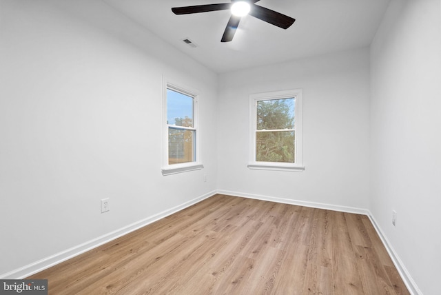 spare room featuring light wood-type flooring and ceiling fan