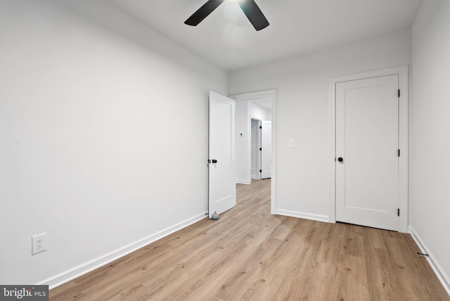 unfurnished bedroom with light wood-type flooring and ceiling fan