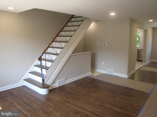 stairway featuring hardwood / wood-style floors