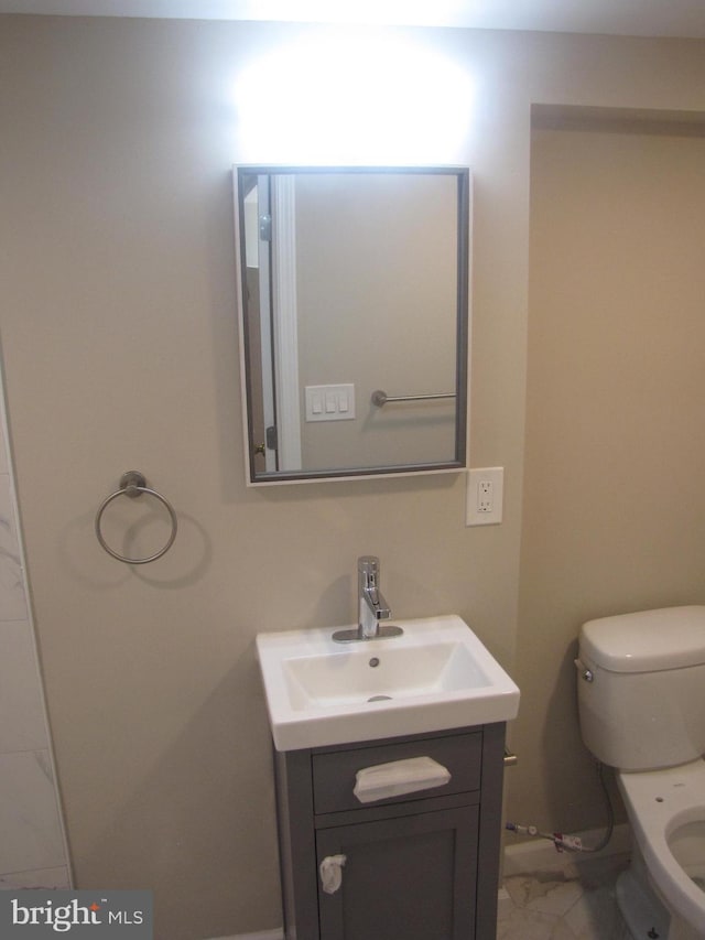 bathroom with vanity and toilet