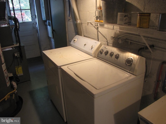 laundry area with washing machine and clothes dryer