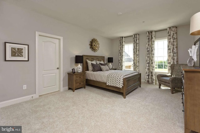 bedroom featuring light colored carpet