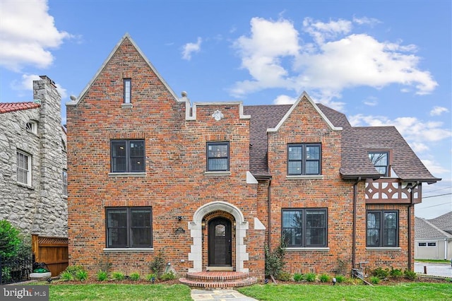 tudor house with a front yard