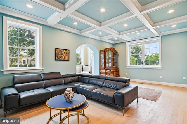 living room featuring light wood-type flooring, crown molding, beam ceiling, and coffered ceiling