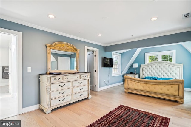 bedroom with connected bathroom, crown molding, and light hardwood / wood-style floors