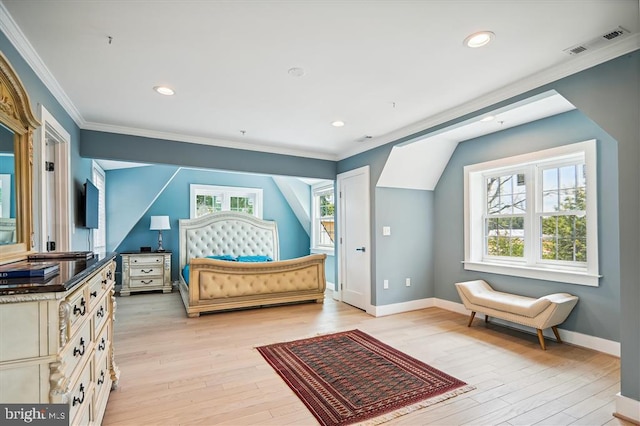 bedroom featuring crown molding, multiple windows, and light hardwood / wood-style floors