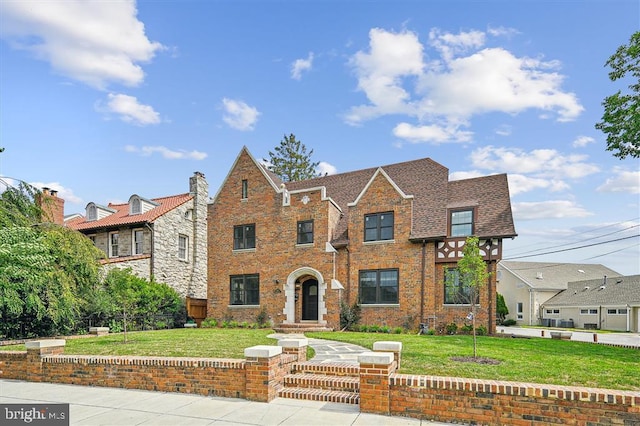 tudor house with a front yard