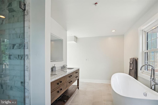 bathroom featuring vanity, tile patterned flooring, and shower with separate bathtub