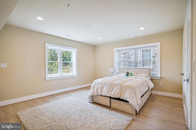 bedroom with light hardwood / wood-style floors