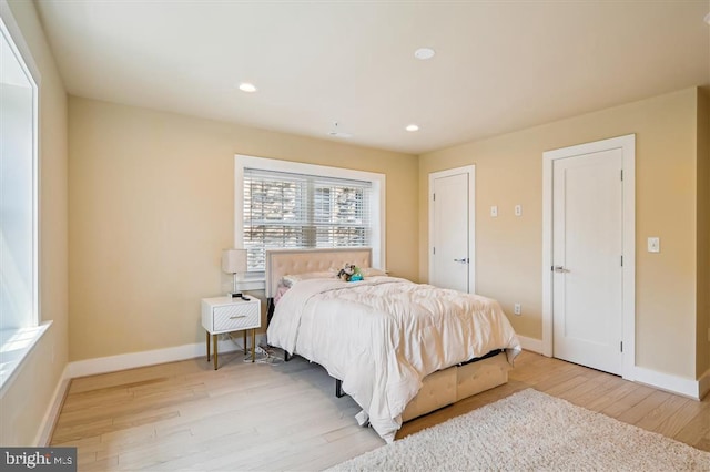 bedroom with light wood-type flooring