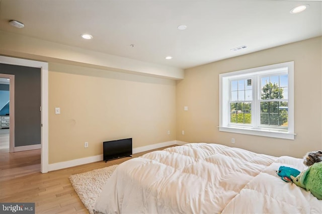 bedroom featuring light hardwood / wood-style flooring