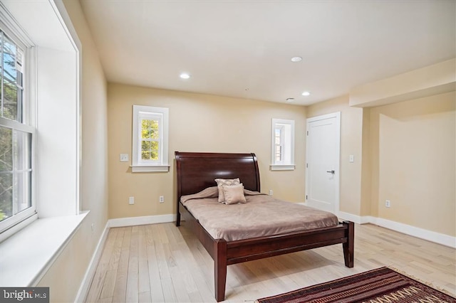 bedroom featuring light hardwood / wood-style flooring and billiards