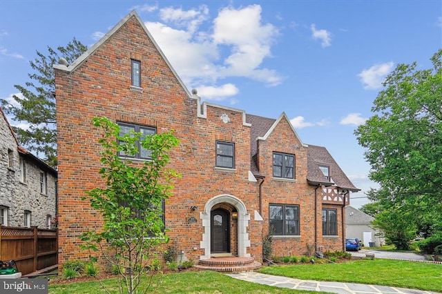 tudor house with a front lawn