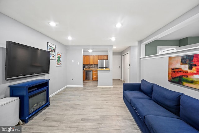 living room with light hardwood / wood-style floors