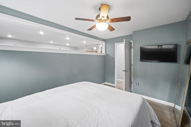 bedroom featuring hardwood / wood-style flooring and ceiling fan