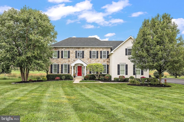 345 Austin Dr, Oxford, PA 19363 - view of front of house with a front yard and stone siding