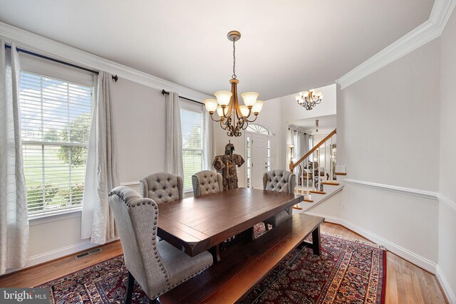 345 Austin Dr, Oxford, PA 19363 - dining space with visible vents, baseboards, an inviting chandelier, ornamental molding, and light wood-type flooring