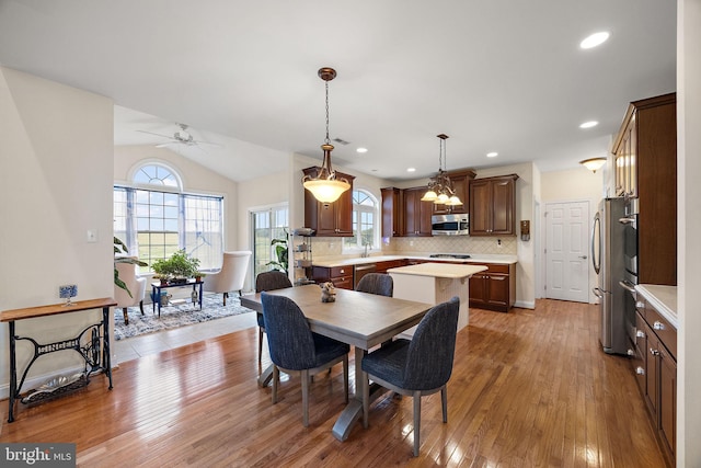 345 Austin Dr, Oxford, PA 19363 - dining area featuring visible vents, recessed lighting, ceiling fan with notable chandelier, light wood-style flooring, and lofted ceiling