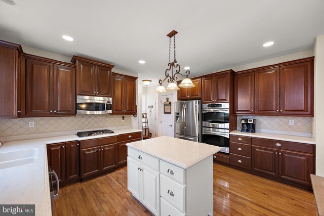 345 Austin Dr, Oxford, PA 19363 - kitchen with light wood-type flooring, a sink, light countertops, and stainless steel appliances