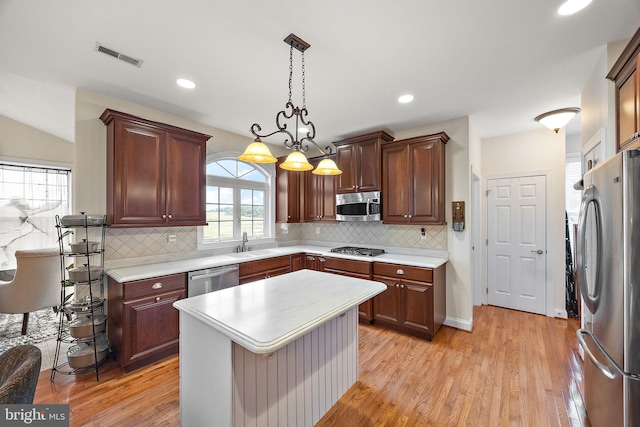 345 Austin Dr, Oxford, PA 19363 - kitchen with stainless steel appliances, light wood finished floors, visible vents, and light countertops