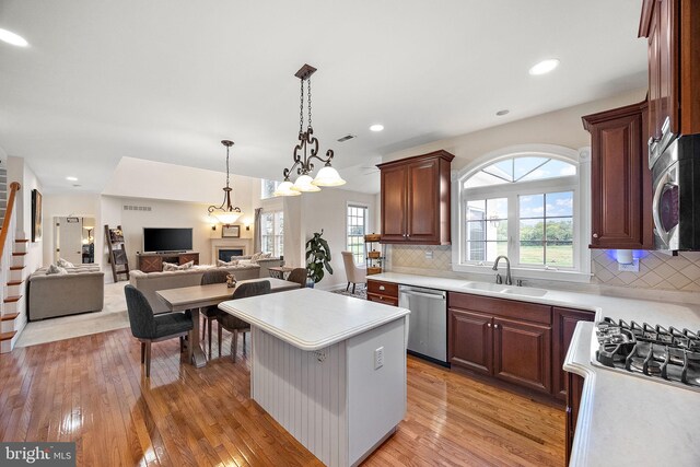 345 Austin Dr, Oxford, PA 19363 - kitchen featuring a kitchen island, light countertops, a sink, stainless steel appliances, and light wood finished floors