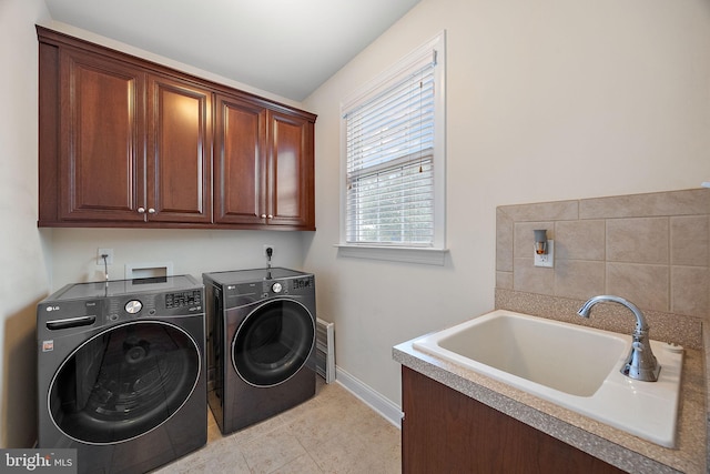 345 Austin Dr, Oxford, PA 19363 - clothes washing area with light tile patterned floors, baseboards, a sink, cabinet space, and washing machine and clothes dryer