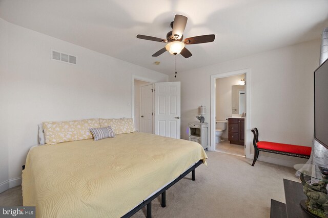 345 Austin Dr, Oxford, PA 19363 - bedroom featuring visible vents, baseboards, a ceiling fan, connected bathroom, and light carpet
