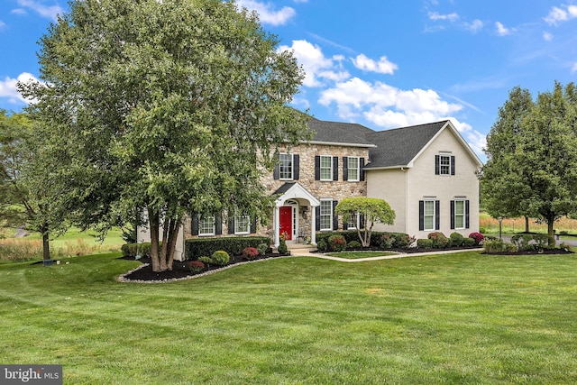 345 Austin Dr, Oxford, PA 19363 - colonial-style house with stone siding and a front lawn