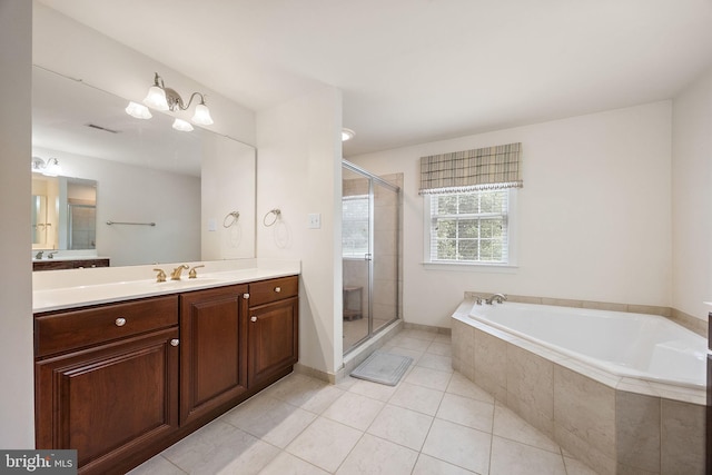 345 Austin Dr, Oxford, PA 19363 - full bath with visible vents, a bath, a shower stall, vanity, and tile patterned flooring