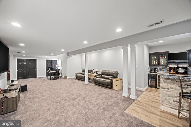 345 Austin Dr, Oxford, PA 19363 - living area with indoor wet bar, wine cooler, visible vents, and recessed lighting