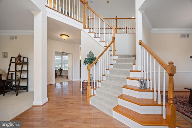 345 Austin Dr, Oxford, PA 19363 - staircase featuring crown molding, visible vents, and wood finished floors