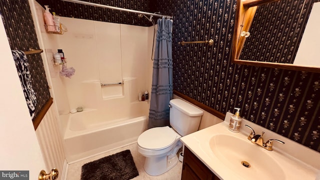 full bathroom featuring shower / bath combination with curtain, vanity, toilet, and tile patterned floors