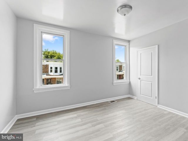 unfurnished room featuring light wood-type flooring