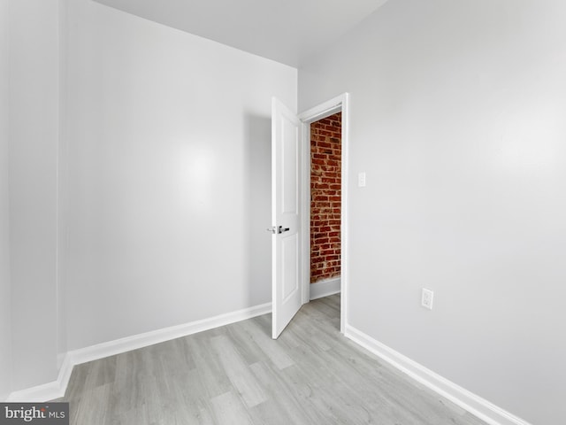 unfurnished room with light hardwood / wood-style flooring