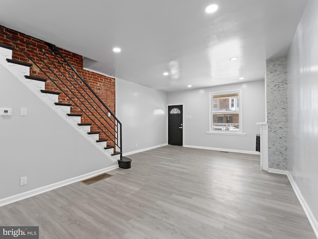 entrance foyer featuring wood-type flooring