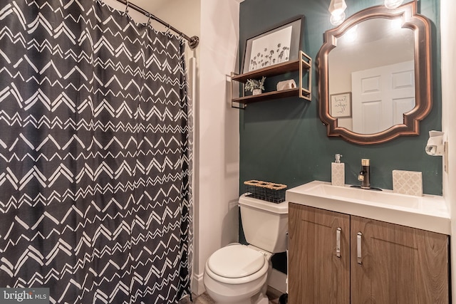 bathroom featuring vanity and toilet