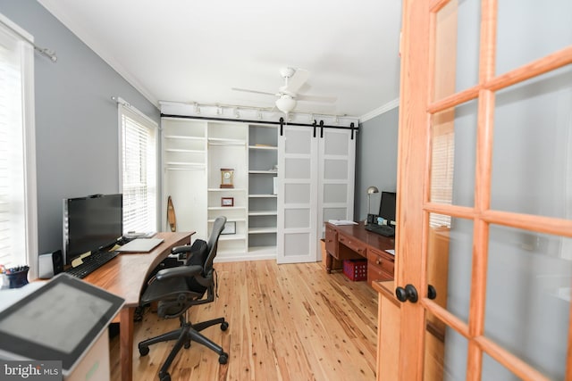 office space with ceiling fan, light hardwood / wood-style floors, and ornamental molding