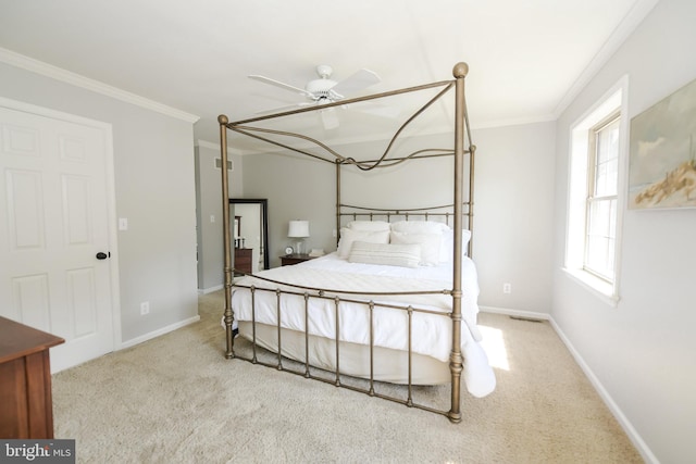 bedroom with ceiling fan, light colored carpet, and ornamental molding