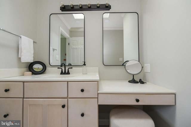 bathroom with vanity and ornamental molding