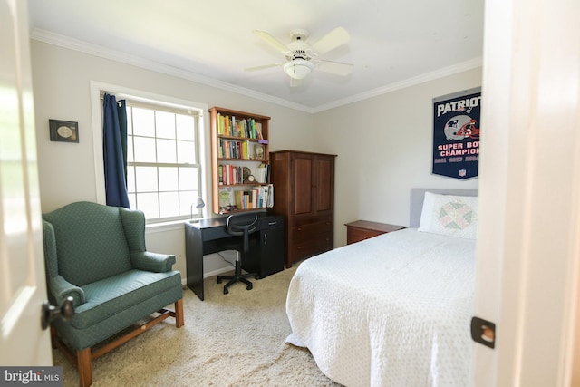 carpeted bedroom featuring ceiling fan and ornamental molding