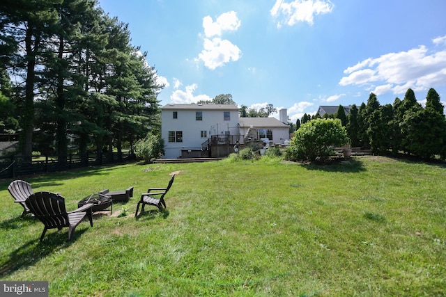 view of yard with a fire pit