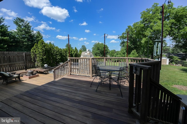 wooden deck featuring a shed