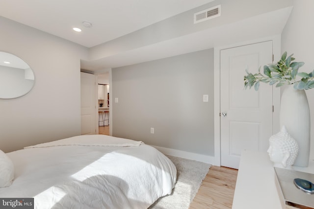 bedroom with light wood-type flooring