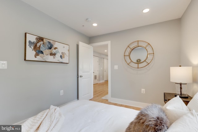 bedroom with light hardwood / wood-style flooring