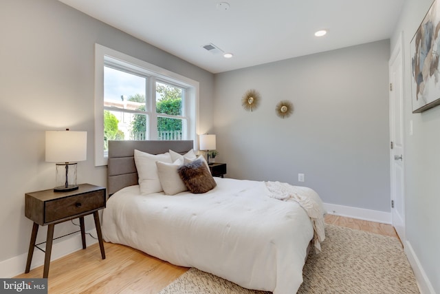 bedroom with light hardwood / wood-style flooring