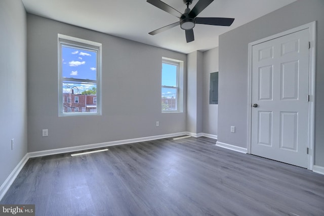 spare room featuring ceiling fan and dark hardwood / wood-style flooring