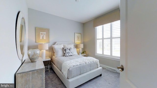 carpeted bedroom featuring fridge